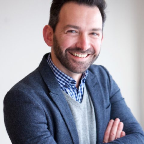 portrait-of-happy-businessman-smiling-in-office-2021-08-28-01-03-54-utc.jpg